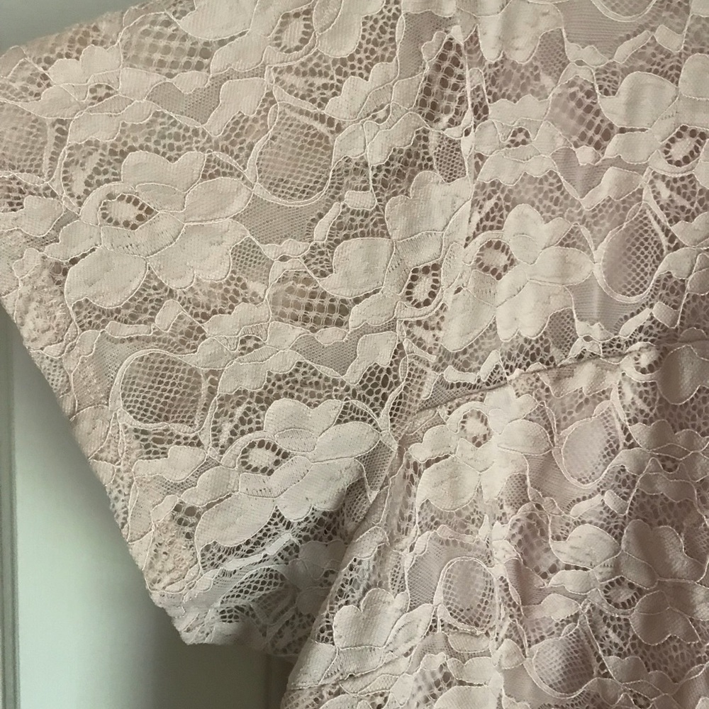 Lacy light pink top with shirt sleeves